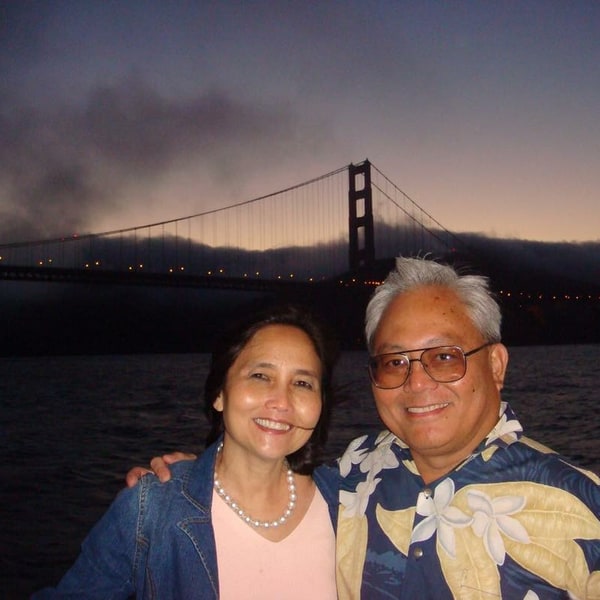 Acelita and Dad smiling together by the Golden Gate Bridge