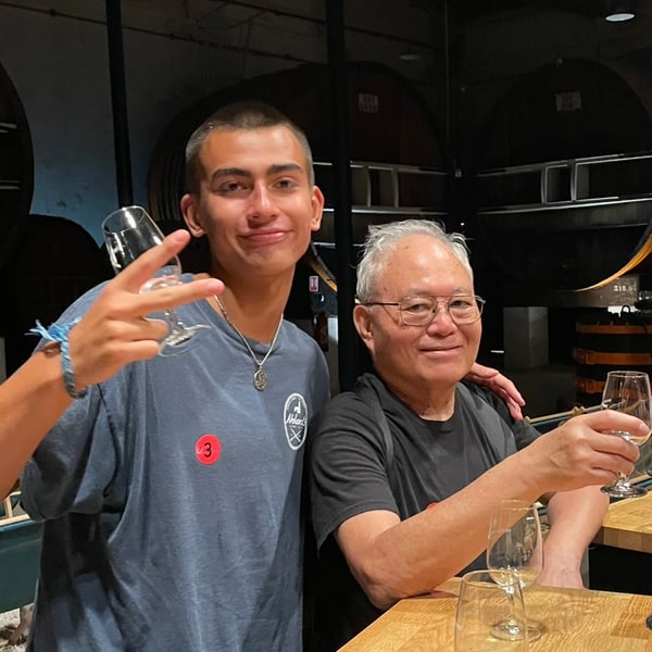 Christopher and Dad raising glasses together