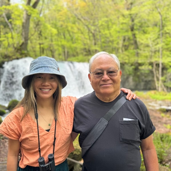 Lisa with Dad in front of a waterfall